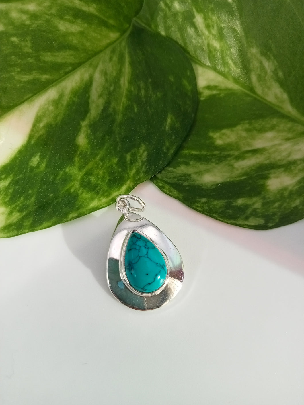 Turquoise Stone set in Silver Case Pendant