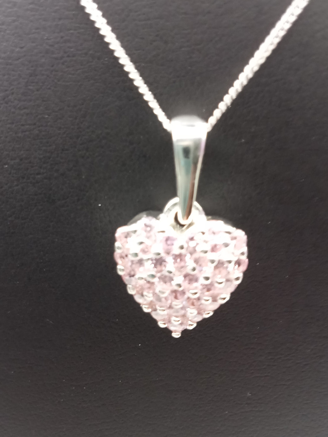 Stone encrusted heart pendant